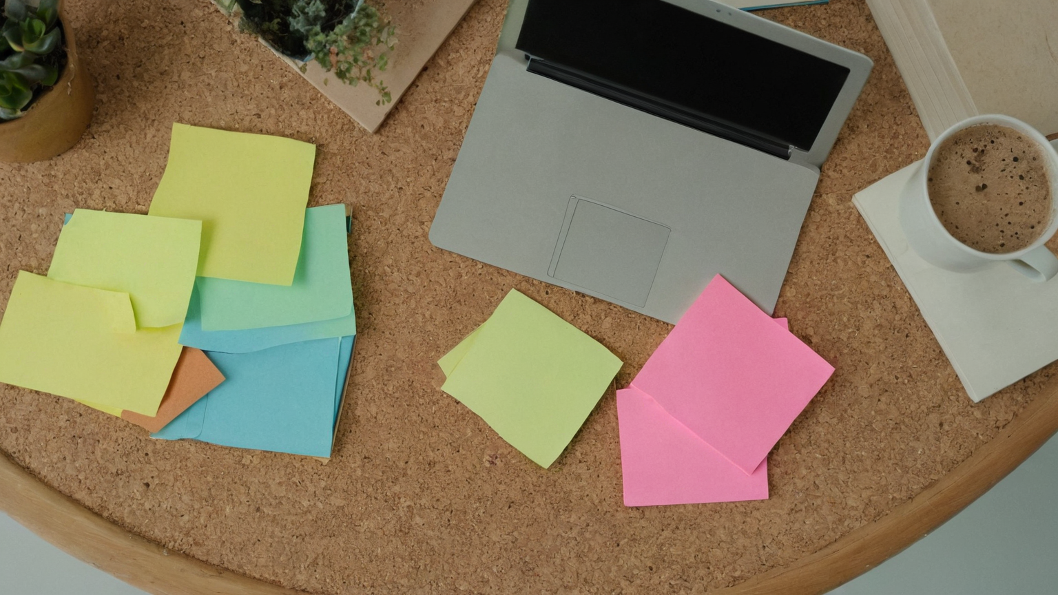 Cork board with blank sticky notes for recall prompts